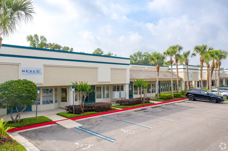Wilshire Plaza commercial building with surface parking