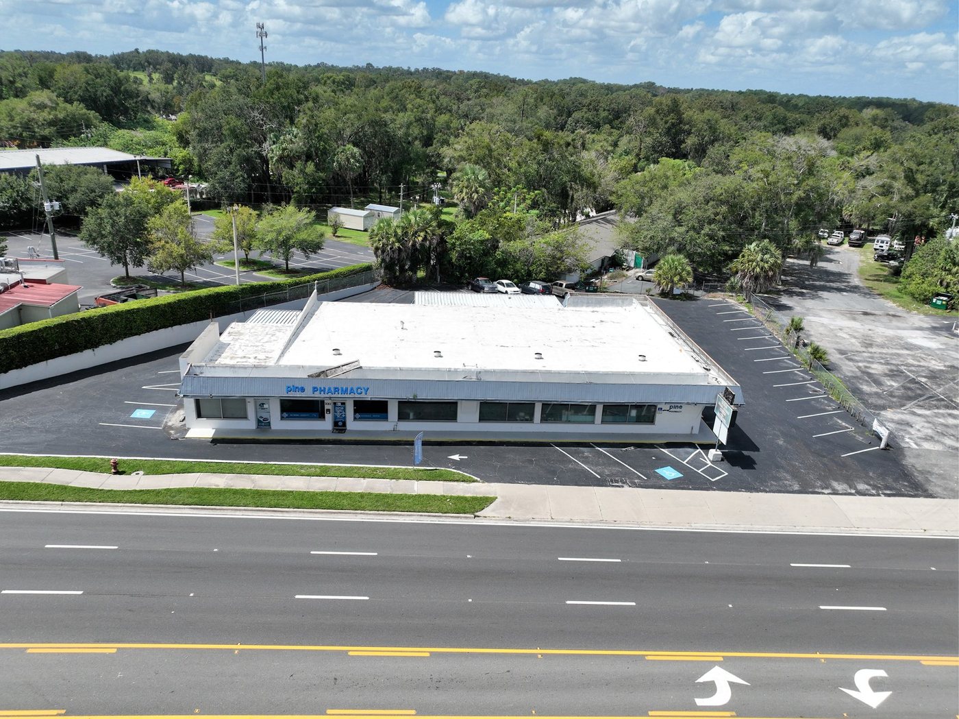 Elevated view of Pine Avenue Plaza, its parking and the South Pine Avenue frontage
