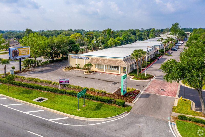 Wilshire Plaza buildings and entrance drive along Wilshire Boulevard in Casselberry, Florida